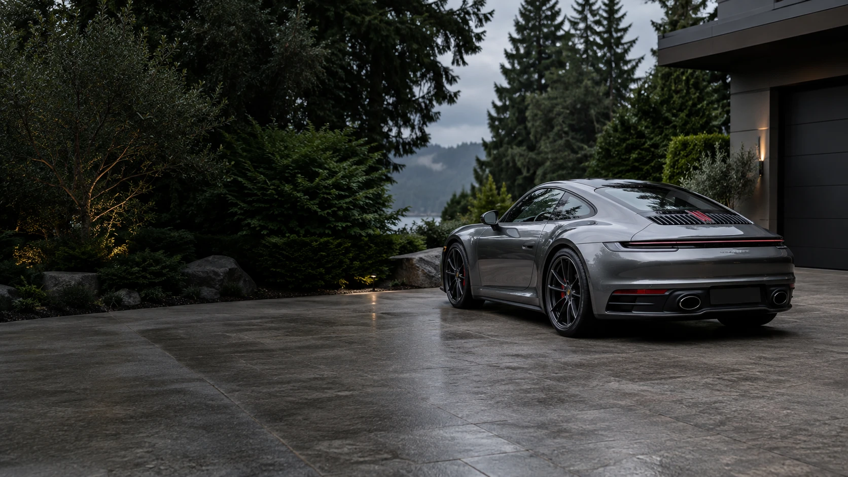 A pristine silver sports car outside a Pacific Northwest home; editorial photograph